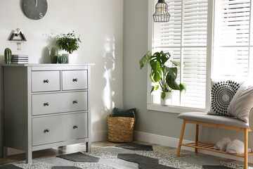 Poster - Grey chest of drawers in stylish room interior