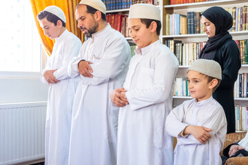 Wall Mural - Arabic muslim family praying togther