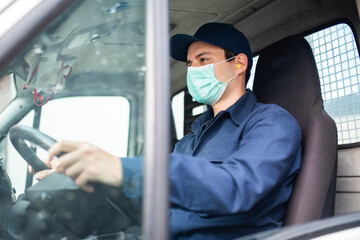 Wall Mural - Truck driver giving driving a van during coronavirus pandemic