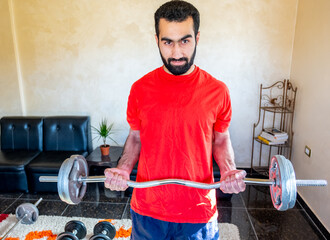 Wall Mural - Guy doing some training at home to keep in good shape