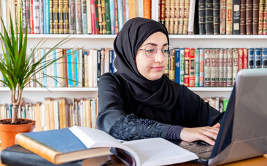 Poster - Arabic muslim woman using laptop for online meetings and studying