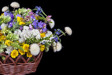 Beautiful Bouquet Of Bright Wildflowers Flowers In Basket Isolated On Black Background