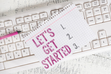 Wall Mural - writing note showing lets get started. business concept for encouraging someone to commence or begin