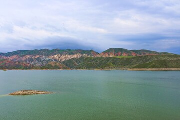 Canvas Print - Amazing shot of a mountain lake on a cloudy sky background in Armenia