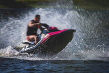 View Of Jet Ski In Motion, Group Of Jet Skiers With A Big Water Splash