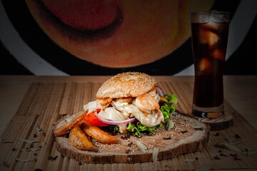 Sticker - Closeup shot of a delicious burger with a glass of coke with ice