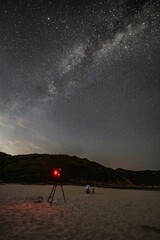 Sticker - Breathtaking scenery of the Milky Way Galaxy in the scenic night sky over the beach