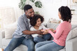 © Prostock-studio - Birthday Concept. Happy Black Father And Daughter Giving Present To Surprised Mom