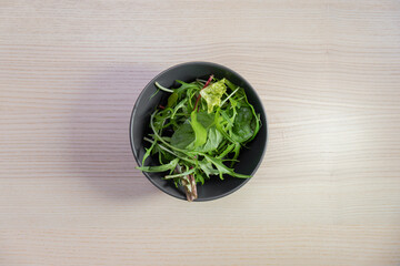 A bowl of green salad.