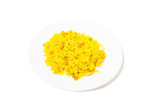 Yellow Rice With Raisins On A White Plate.