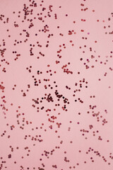 Wall Mural - Background of colorful pink, red sparkling confetti. Holiday concept