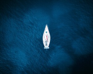 Sticker - Aerial view of a boat in the blue sea