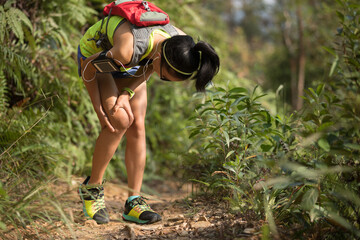 Sticker - Young fitness woman runner with sports injury on her knee