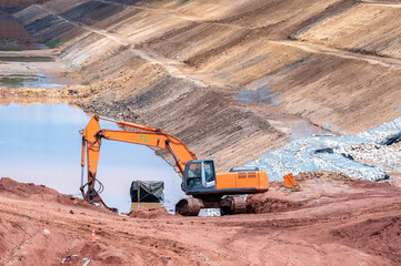 Front End Loader,Excavator working at construction site.