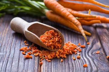 Wall Mural - Close view carrot seasoning in wooden spoon