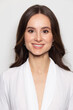 © Tim Turner - Photobooth portrait of a brunette caucasian woman reaching the standards of an official passport photo.