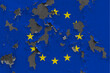 European Union flag close up painted, damaged and dirty on wall peeling off paint to see concrete surface. Vintage National Concept.