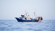 Landscape Shot Of A Fishing Trawler On A Sunny Day