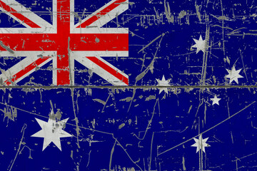Australia flag painted on cracked dirty surface. National pattern on vintage style surface. Scratched and weathered concept.