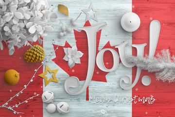 Wall Mural - Canada flag on wooden table with joy text. Christmas and new year background, celebration national concept with white decor.