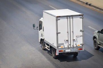 truck running on the road, small truck on the road.