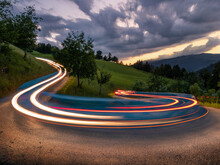 Curvy serpentine road through Austrian Alps mountains. Long exposure showing the movement of traffic near Zell am See in Austria.