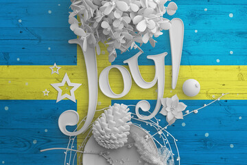 Wall Mural - Sweden flag on wooden table with Joy text. Christmas and new year background, celebration national concept with white decor.