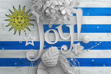Wall Mural - Uruguay flag on wooden table with Joy text. Christmas and new year background, celebration national concept with white decor.