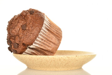 Chocolate muffins, close-up, isolated on a white background.