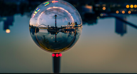 Wall Mural - Dusseldorf, Germany - Night View Crystal Glass Ball Travel around the World - TV Tower Harbor Rhine River Promenade in Dusseldorf Germany