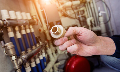 Sticker - Heating engineer fixing modern heating system in boiler room. 