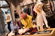 © BGStock72 - Two young women choosing winter clothes
