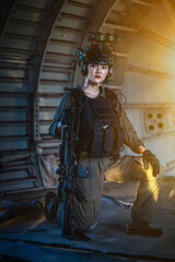 Portrait of female modern army special forces soldier, anti terrorist squad fighter, elite commando warrior using four-eyed night vision goggles in dark background