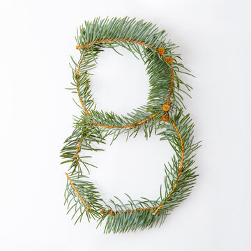 number 8 from green christmas-tree isolated on white. Natural number eight, stylish alphabet. Handmade abc. Text from spruce. Christmas winter Sale. X-mas numbers. Winter font. 