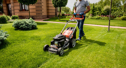 Gardener mowing the lawn. Landscape design. Green background