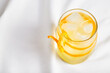 Cool refreshing alcohol cocktail decorated with orange zest