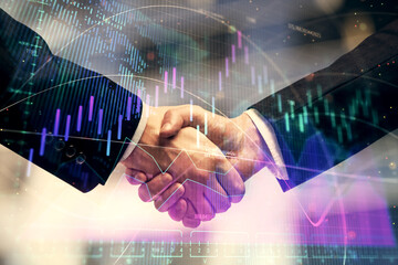 Double exposure of forex graph hologram and handshake of two men. Stock market concept.