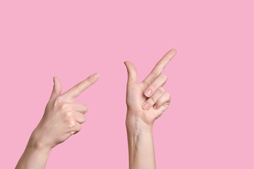 Pointer up. Two Caucasian hands indicate the direction up, above, high.