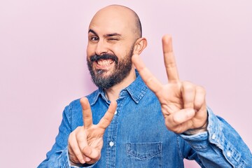 Poster - Young handsome man wearing casual clothes smiling looking to the camera showing fingers doing victory sign. number two.