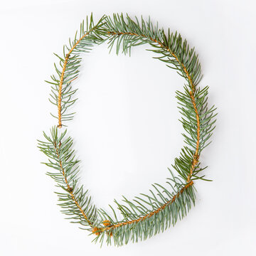Letter O from green christmas-tree isolated on white. Natural Letter O, stylish alphabet. Handmade abc. Text from spruce. Christmas winter Sale. X-mas numbers. Winter font. 