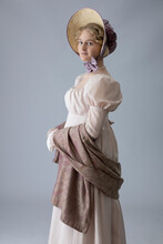 A Young Regency Period Woman In A Pale Pink Gown