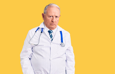 Poster - Senior handsome grey-haired man wearing doctor coat and stethoscope skeptic and nervous, frowning upset because of problem. negative person.