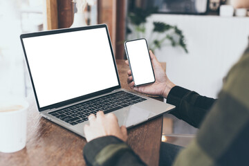 computer,cell phone mockup image.hand woman work using laptop texting mobile.blank screen with white background for advertising,contact business search information on desk in cafe.marketing,design