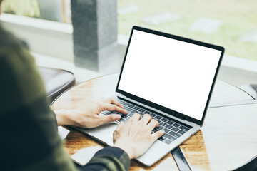 computer mockup image blank screen.hand woman work using laptop with white background for advertising,contact business search information on desk at coffee shop.marketing and creative design