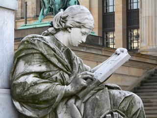 Poster - Beautiful closeup shot of an ancient gray stone statue in Berlin