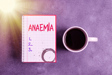 Text sign showing Anaemia. Business photo text a condition marked by a deficiency of hemoglobin in the blood Paper accesories with digital smartphone arranged on different background