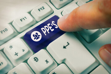 Poster - Word writing text Ppe s is. Business photo showcasing Specialized equipment for protection against health and safety hazard White pc keyboard with empty note paper above white key copy space