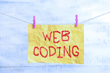 Fototapete - Word writing text Web Coding. Business photo showcasing a system of symbols and rules used to represent instructions Clothesline clothespin rectangle shaped paper reminder white wood desk