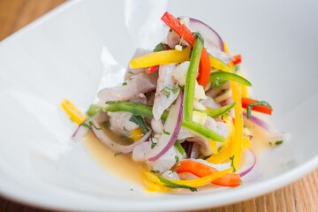 Poster - Closeup shot of a vegetable salad on a white plate