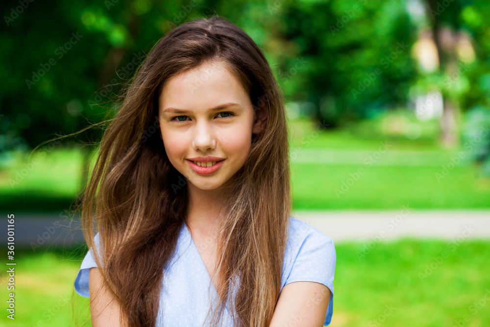 Portrait of a young beautiful brunette girl in summer park Stock Photo ...